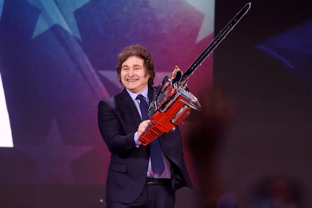 Javier Milei poses with a chainsaw at CPAC